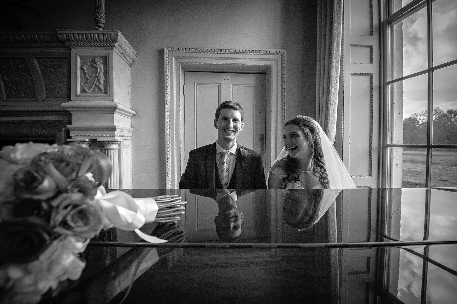 Wedding Couple Posing at Piano at Hampton Court House